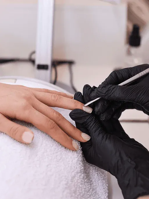 Fresh pedicure with polished white toenails in a relaxed salon setting